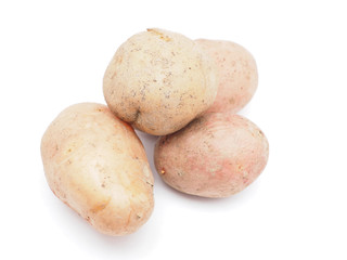 unpeeled potatoes on a white background