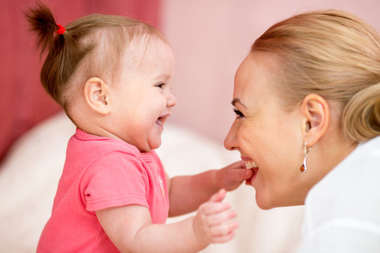 Mom looks with love at baby. Parenthood happiness conception.