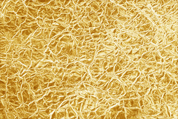 Shiny yellow leaf gold foil texture background