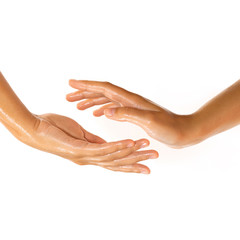 Close-up of female hands while applying oil
