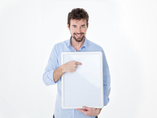 young man in casual clothes pointing something on an empty board
