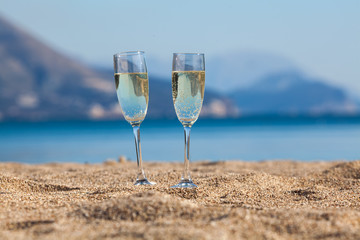 Wine glasses on a beach