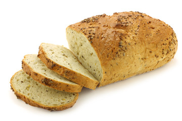 freshly baked cut loaf of cornbread on a  white background