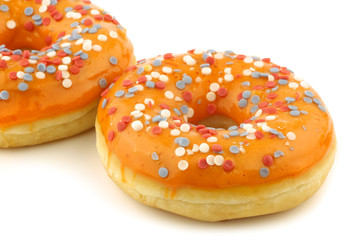 orange donut with red,white and blue sprinkles