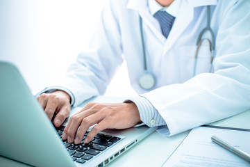 Close-up of a medical worker with laptop