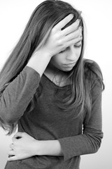 Black and white portrait of teenager sick with period