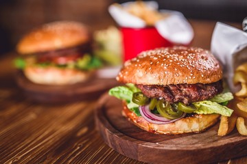 Fresh burger on wooden table.