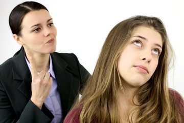 Young female teenager annoyed by angry mother