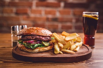 Fresh burger on wooden table.
