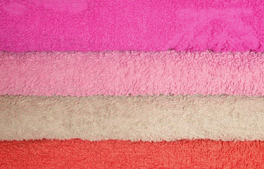 Stack of pink and purple towels