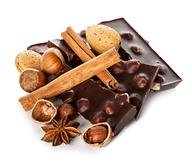 Chocolate and nuts with cinnamon sticks, star anise isolated