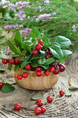Cowberries in wooden bowl