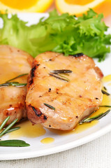 Grilled pork steak with orange sauce