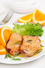 Delicious pork chop with orange sauce