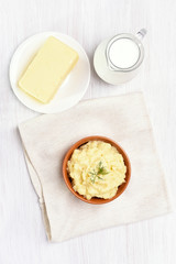 Mashed potato, jug of milk and butter