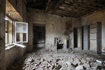 Fototapeta na wymiar old abandoned room with window and fireplace