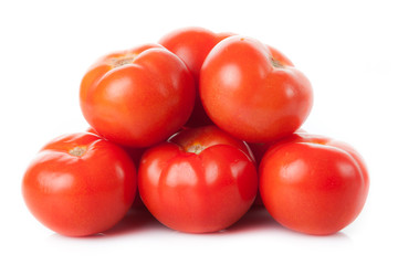 Fresh tomatoes isolated on white. Closeup of tomatoes