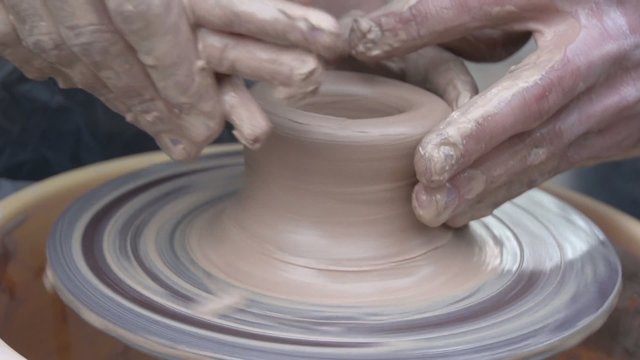 Clay pot on a potter's wheel