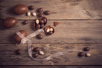 Chocolate Easter Eggs Over Wooden Background