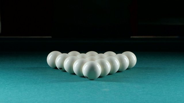 Triangle forms a pyramid of billiard balls