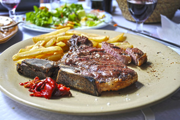 T-bone steak and fries