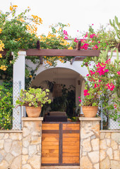 Beautiful entrance into the courtyard with flowers.