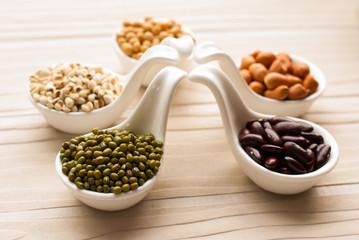 collection set of beans, legumes, peas, lentils on ceramic spoon