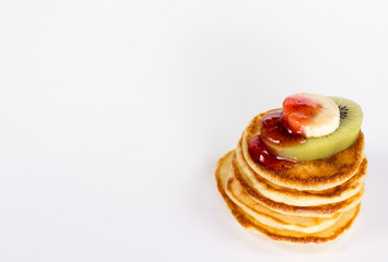 isolated stack of pancake with fruits and jam