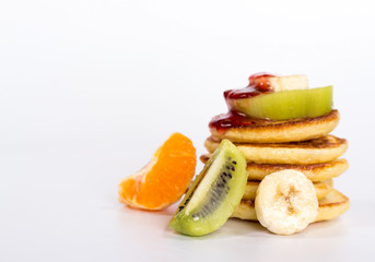 isolated stack of pancake with fruits and jam