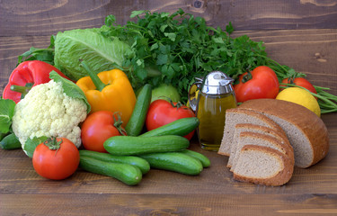 Vegetables, olive oil  and bread. Healthy eating.