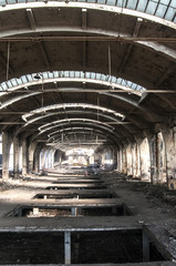 Old abandoned decayed grunge hall of vintage railway plant