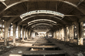 Fototapeta na wymiar Old abandoned decayed grunge hall of vintage railway plant