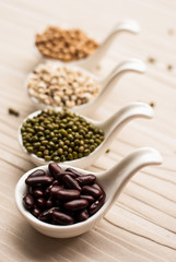 collection set of beans, legumes, peas, lentils on ceramic spoon