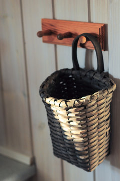 Kitchen basket on wooden hanger