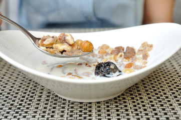 Mix cereals in white bowl on table
