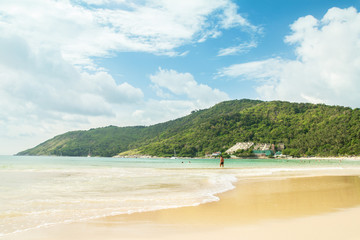 Fototapeta na wymiar idyllic beach with green hills