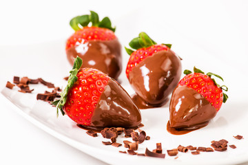 Ripe strawberries dipped in chocolate.