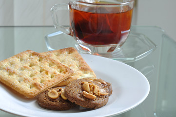 Cup of tea with cookie and bread, tea-break.