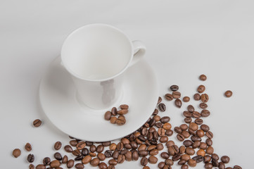 Coffee cup and beans on a white background.