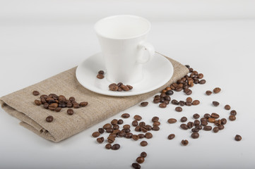 Coffee cup and beans on a white background.