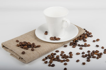 Coffee cup and beans on a white background.