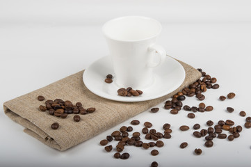 Coffee cup and beans on a white background.
