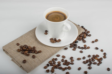Coffee cup and beans on a white background.