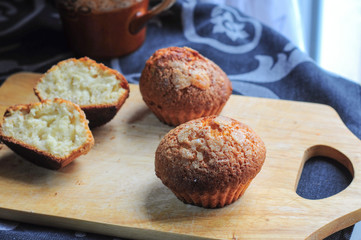Vanilla muffins on kitchen board
