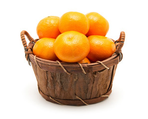 Mandarin in basket isolated on white