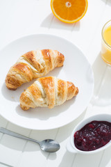 delicious breakfast with croissants and juice