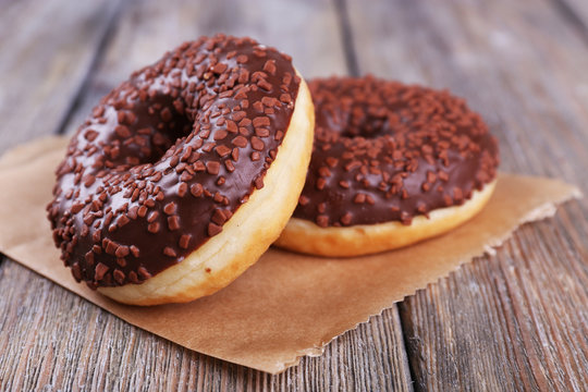 Delicious donuts with icing and chocolate crumb