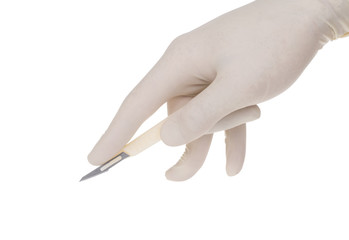 scalpel holded by doctor's hand on white background