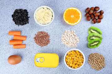 Various food products containing vitamins on table