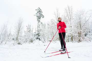 Cross-country skiing: young woman cross-country skiing